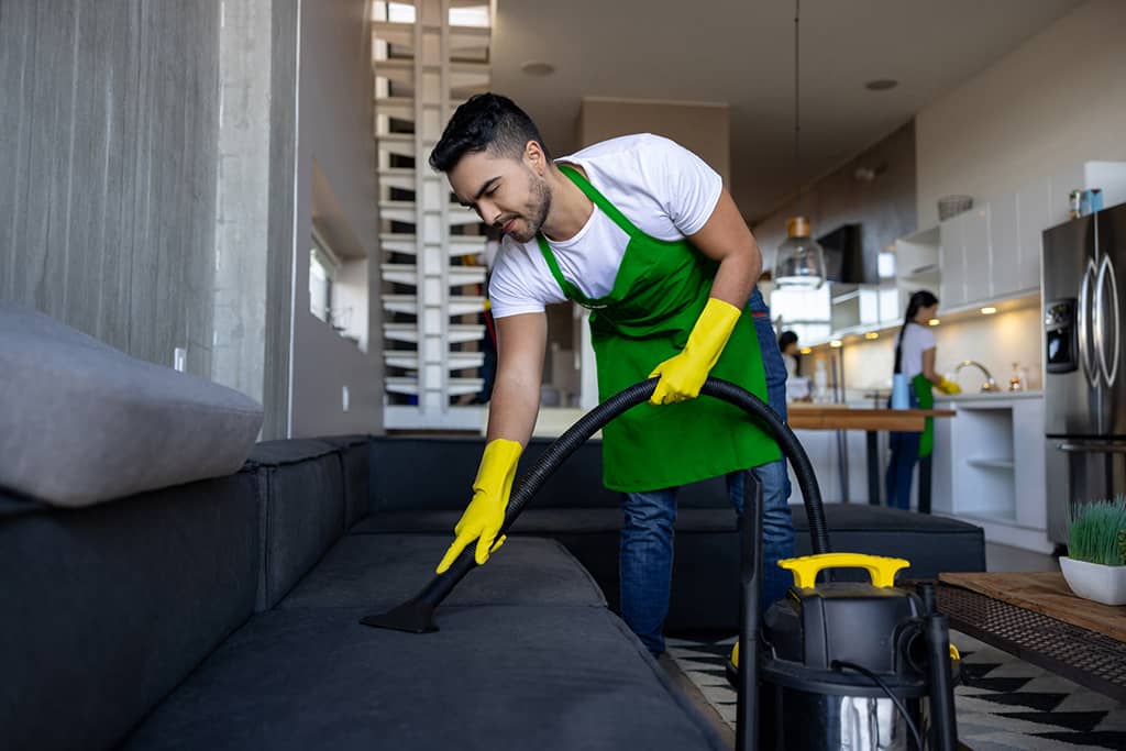 Guelph cleaners Go Maid team cleaning a living room